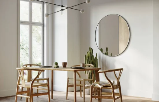 dining room with mirror on the wall