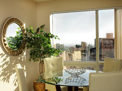 dining room with mirrored wall